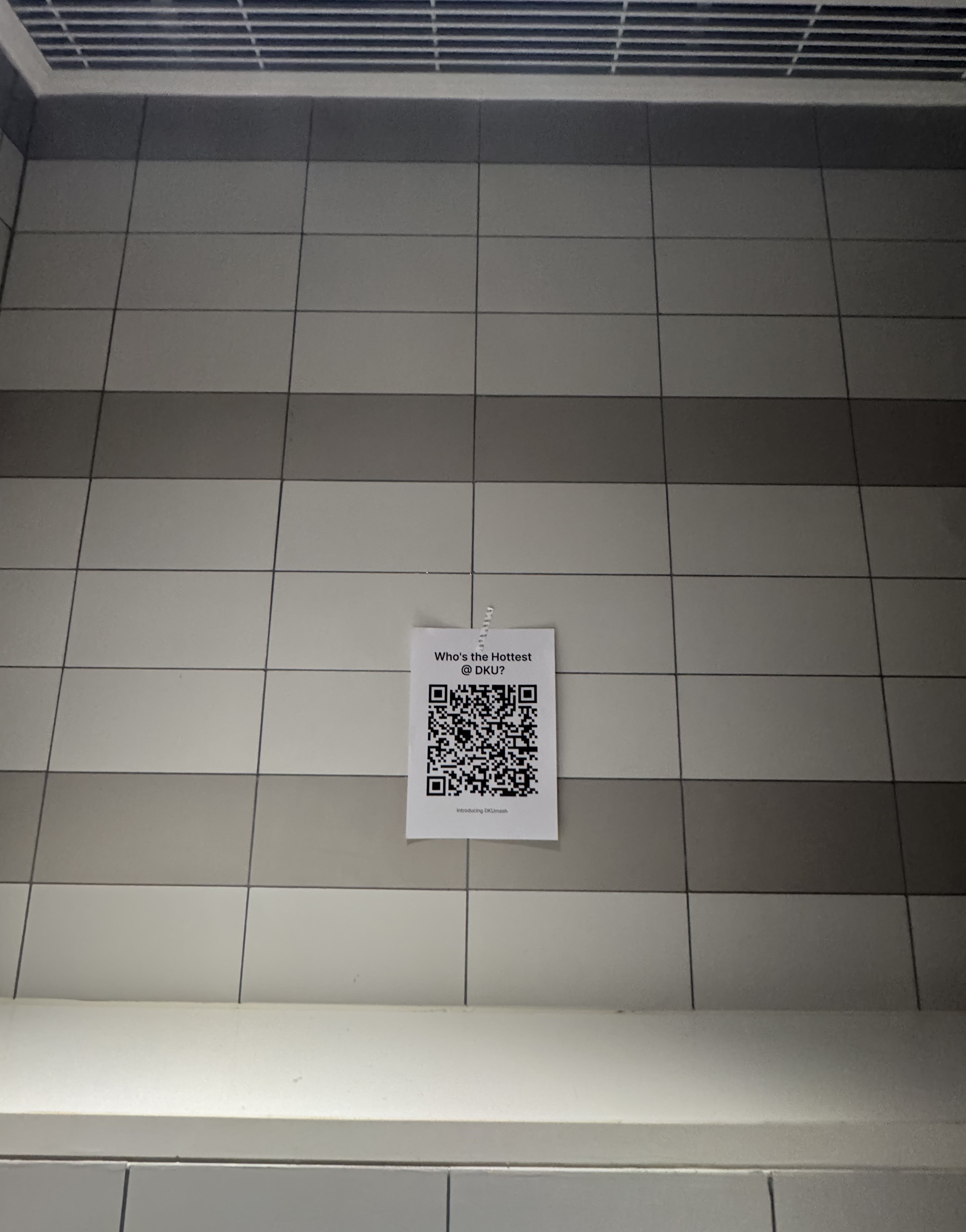 How it started - QR Code flyer on bathroom floor